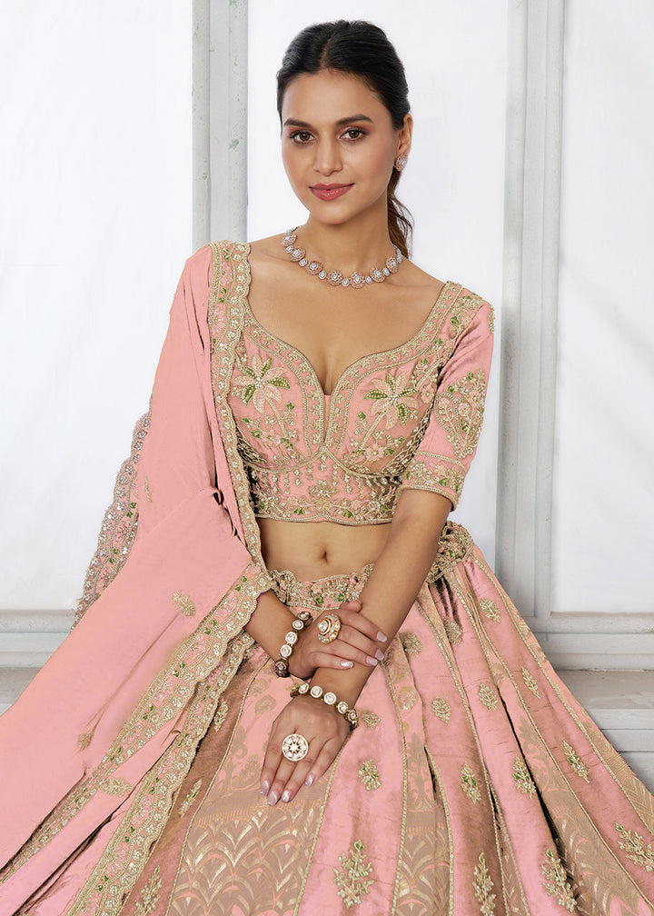 Buy Now Designer Pink Raw Silk Lehenga with Intricate Embroidered Detailing Online in US, UK, Canada, France, Italy, Greece, Sweden, UAE &amp; Worldwide at Empress.