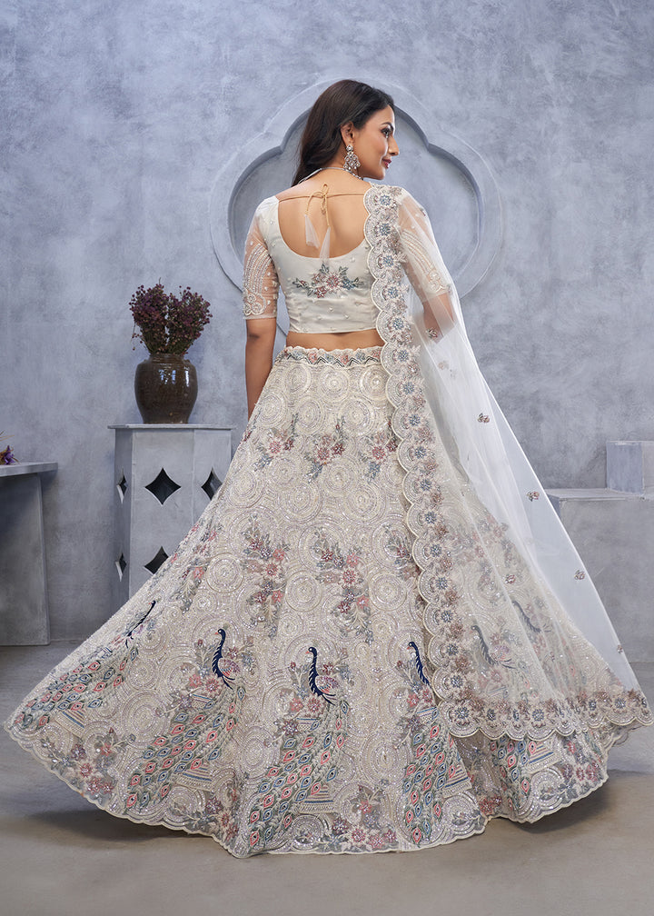 Buy Now Majestic Ivory Soft Net Embroidered Bridal Lehenga Choli Online in USA, UK, France, UAE & Worldwide at Empress Clothing. 