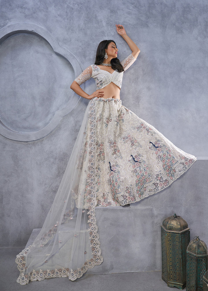 Buy Now Majestic Ivory Soft Net Embroidered Bridal Lehenga Choli Online in USA, UK, France, UAE & Worldwide at Empress Clothing. 