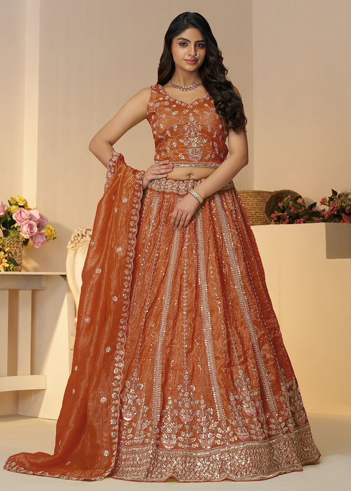 Buy Now Orange Jimmy Choo Material Wedding Festive Lehenga Choli Online in USA, UK, Canada, France, Italy, Germany, Austria, UAE & Worldwide at Empress.