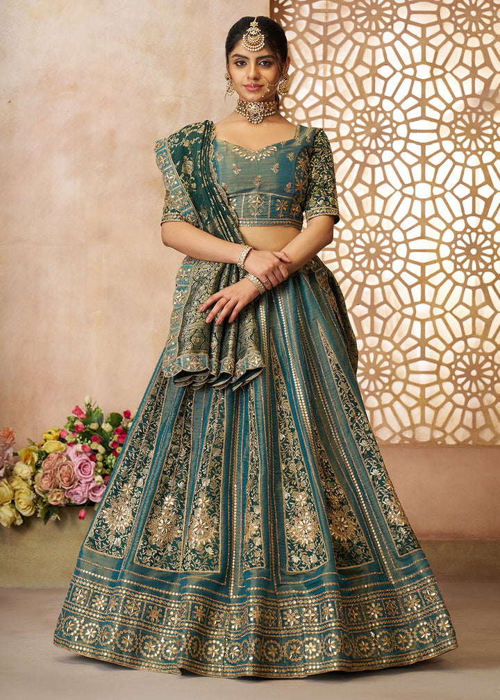 Buy Now Green Tissue Net Heavy Embroidered Bridal Lehenga Choli Online in USA, UK, Canada, France, Italy, Germany, Austria, UAE & Worldwide at Empress Clothing.