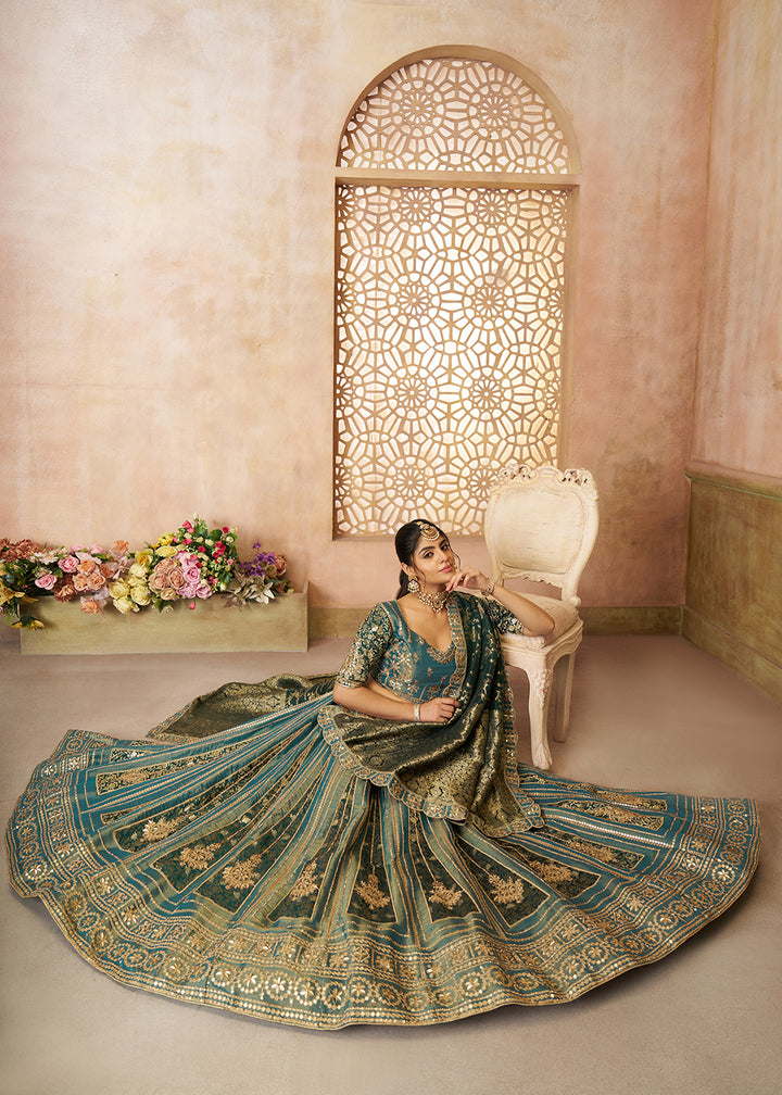 Buy Now Green Tissue Net Heavy Embroidered Bridal Lehenga Choli Online in USA, UK, Canada, France, Italy, Germany, Austria, UAE & Worldwide at Empress Clothing.