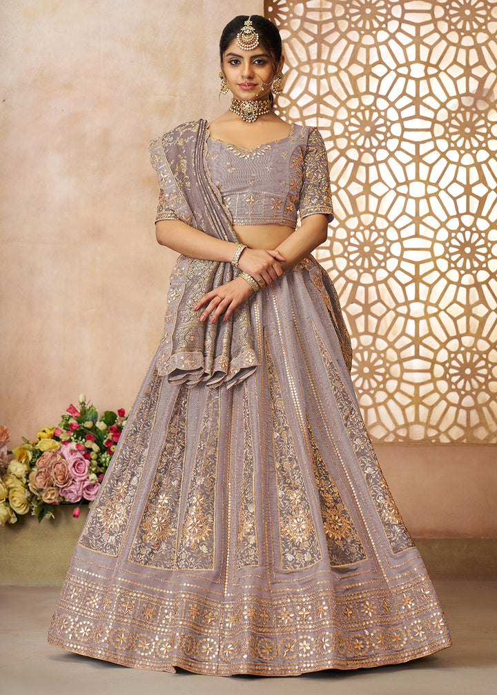 Buy Now Mauve Tissue Net Heavy Embroidered Bridal Lehenga Choli Online in USA, UK, Canada, France, Italy, Germany, Austria, UAE & Worldwide at Empress Clothing.