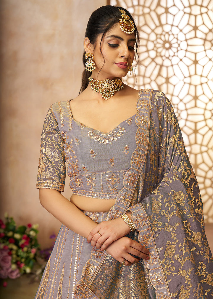 Buy Now Mauve Tissue Net Heavy Embroidered Bridal Lehenga Choli Online in USA, UK, Canada, France, Italy, Germany, Austria, UAE & Worldwide at Empress Clothing.