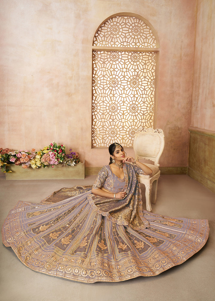 Buy Now Mauve Tissue Net Heavy Embroidered Bridal Lehenga Choli Online in USA, UK, Canada, France, Italy, Germany, Austria, UAE & Worldwide at Empress Clothing.