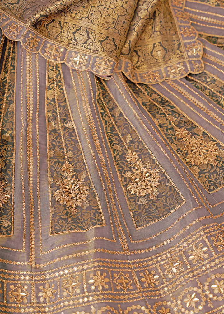 Buy Now Mauve Tissue Net Heavy Embroidered Bridal Lehenga Choli Online in USA, UK, Canada, France, Italy, Germany, Austria, UAE & Worldwide at Empress Clothing.