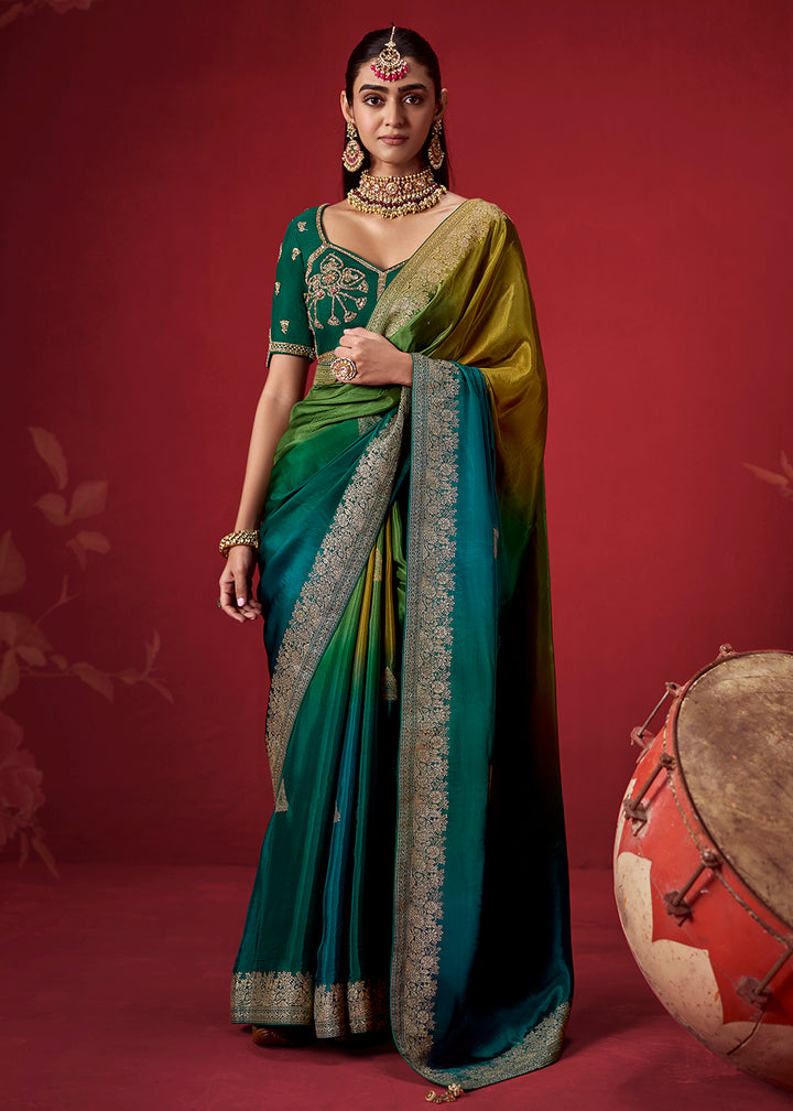 Buy Now Rich Dark Green Dola Crape Silk Festive Designer Saree Online in US, UK, Canada, France, Germany, Denmark, Sweden, Austria &amp; Worldwide at Empress.