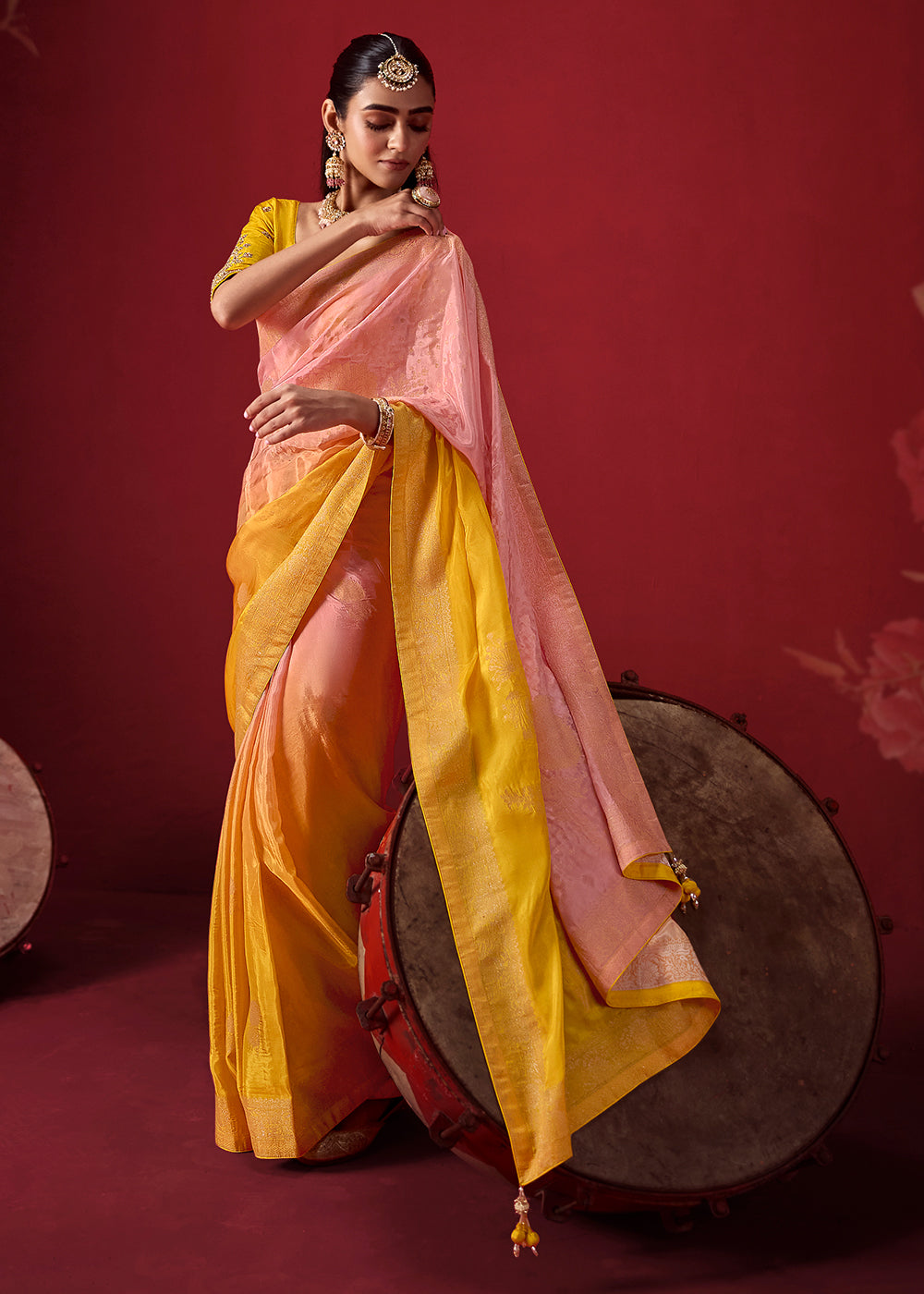 Buy Now Rich Yellow &amp; Pink Dola Crape Silk Festive Designer Saree Online in US, UK, Canada, France, Germany, Denmark, Sweden, Austria &amp; Worldwide at Empress.