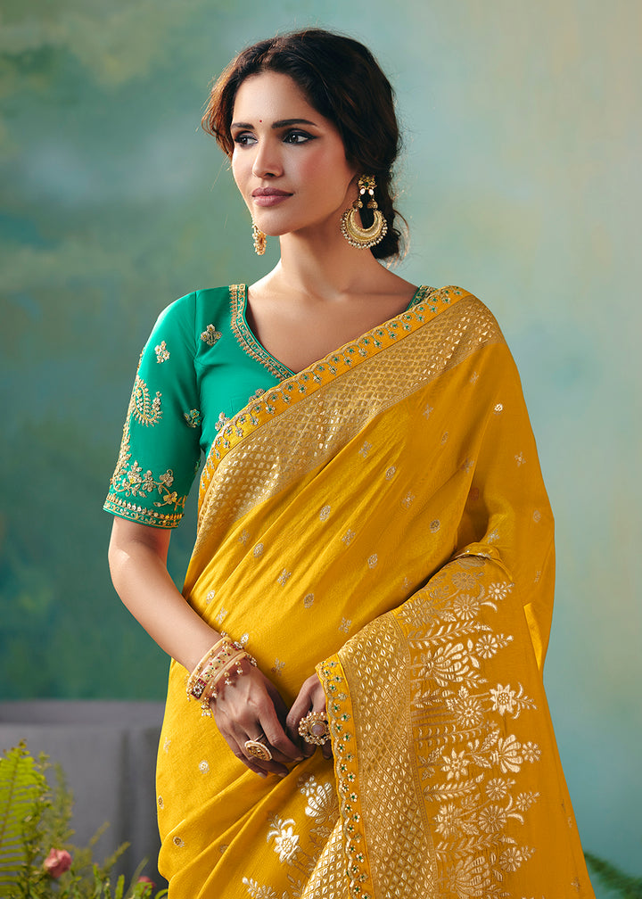 Buy Fancy Yellow Premium Dola Viscose Silk Wedding Wear Saree Online in US, UK, Canada, France, Germany, Denmark, Spain, Belgium, Sweden & Worldwide at Empress.