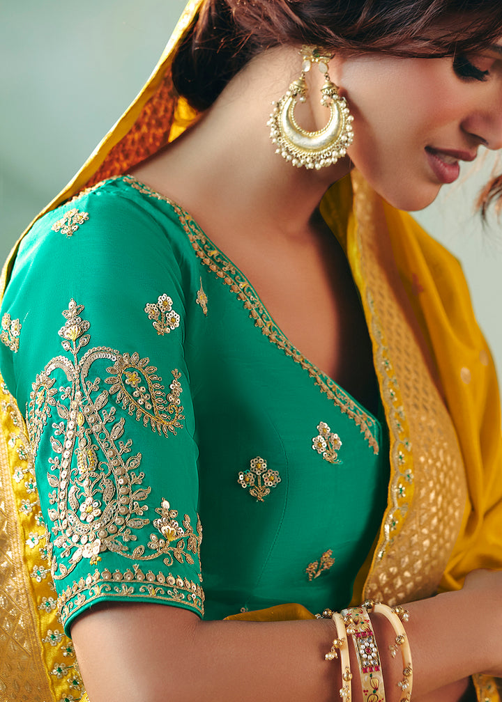 Buy Fancy Yellow Premium Dola Viscose Silk Wedding Wear Saree Online in US, UK, Canada, France, Germany, Denmark, Spain, Belgium, Sweden & Worldwide at Empress.