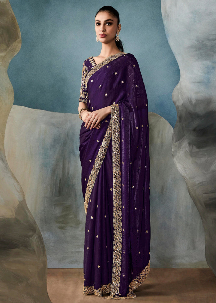 Radiant Purple tissue saree with intricate handwork & cutwork embroidery. Includes matching blouse piece. Perfect for wedding & festivals. Shop Now.
