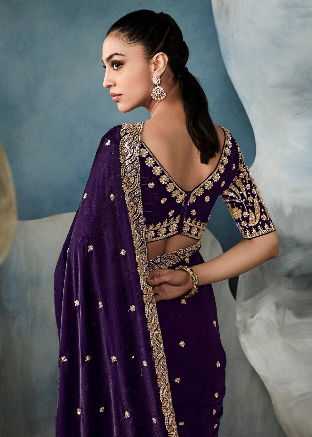 Radiant Purple tissue saree with intricate handwork & cutwork embroidery. Includes matching blouse piece. Perfect for wedding & festivals. Shop Now.