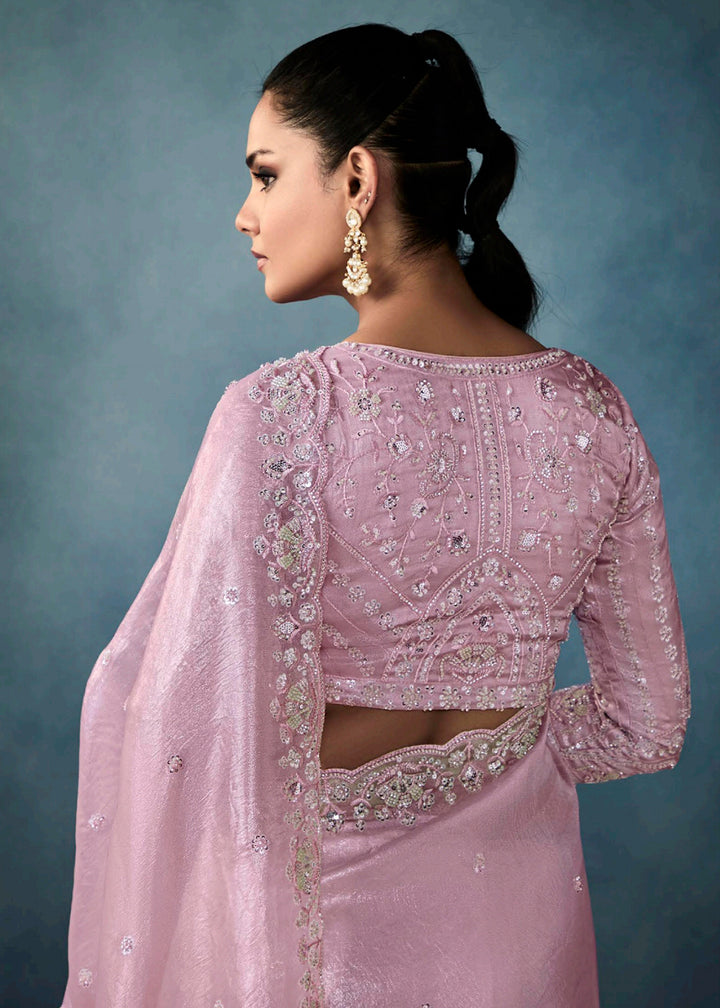 Radiant Pink tissue saree with intricate handwork & cutwork embroidery. Includes matching blouse piece. Perfect for wedding & festivals. Shop Now.