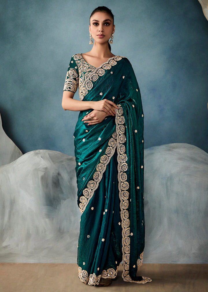 Radiant Green tissue saree with intricate handwork & cutwork embroidery. Includes matching blouse piece. Perfect for wedding & festivals. Shop Now.