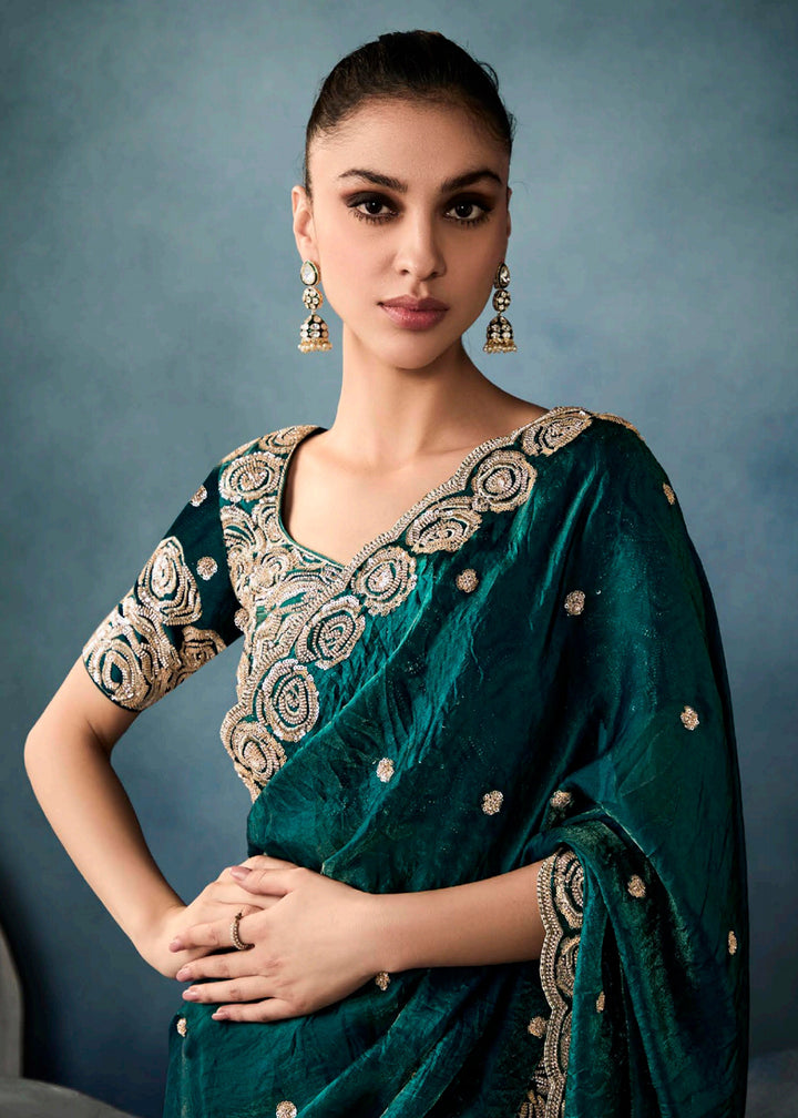 Radiant Green tissue saree with intricate handwork & cutwork embroidery. Includes matching blouse piece. Perfect for wedding & festivals. Shop Now.