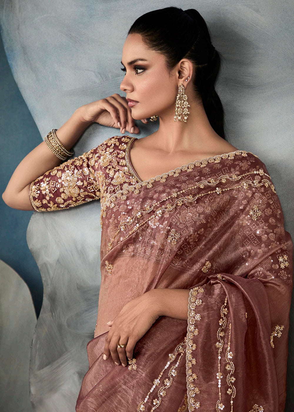 Radiant Mauve tissue saree with intricate handwork & cutwork embroidery. Includes matching blouse piece. Perfect for wedding & festivals. Shop Now.