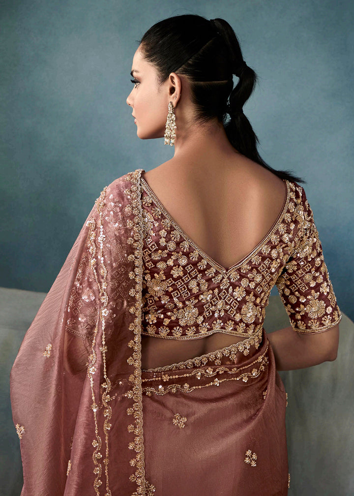 Radiant Mauve tissue saree with intricate handwork & cutwork embroidery. Includes matching blouse piece. Perfect for wedding & festivals. Shop Now.