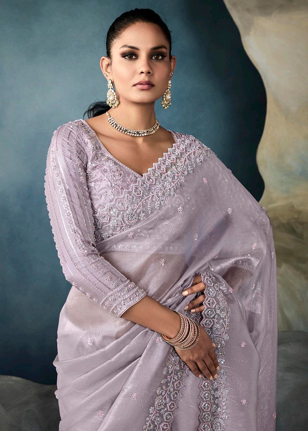 Radiant Lavender tissue saree with intricate handwork & cutwork embroidery. Includes matching blouse piece. Perfect for wedding & festivals. Shop Now.