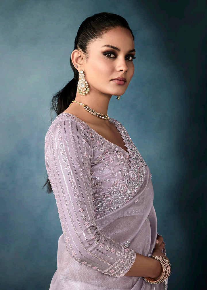 Radiant Lavender tissue saree with intricate handwork & cutwork embroidery. Includes matching blouse piece. Perfect for wedding & festivals. Shop Now.