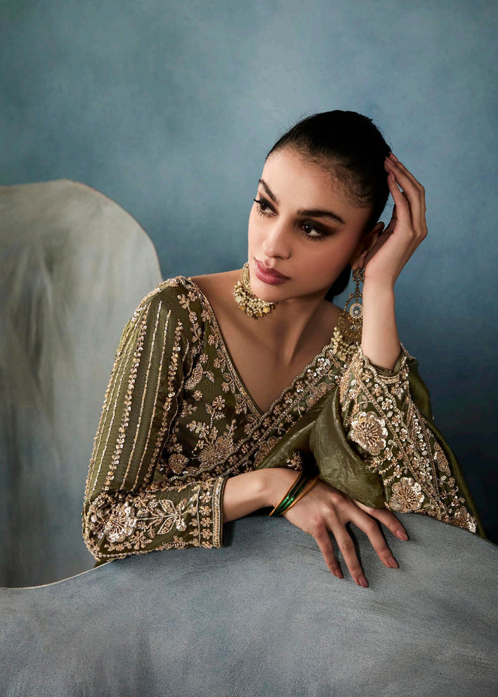 Radiant Green tissue saree with intricate handwork & cutwork embroidery. Includes matching blouse piece. Perfect for wedding & festivals. Shop Now.