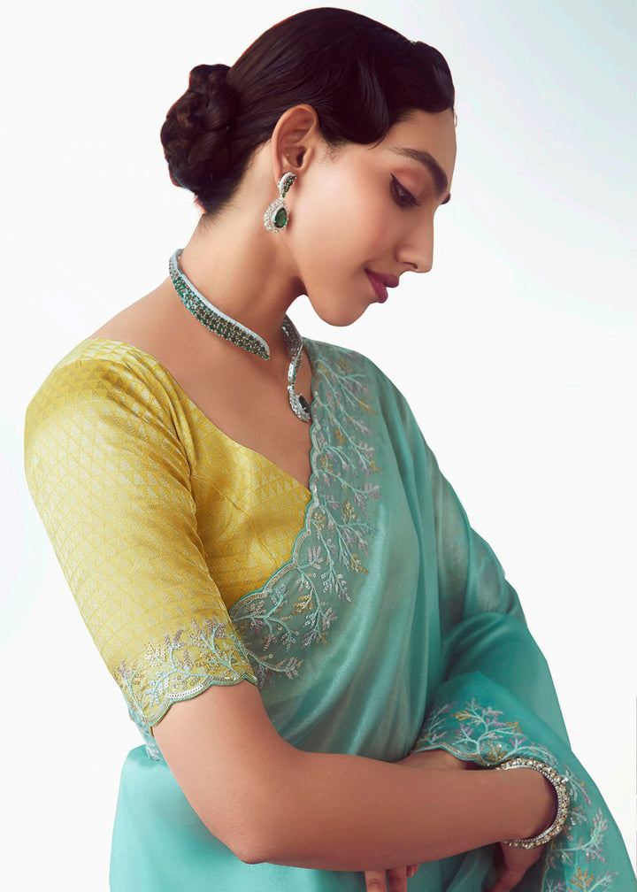 Buy Sky & Yellow Fancy Fabric Embroidered Designer Saree Online in USA, UK, Canada, France, Germany, Italy, Denmark, UAE, Singapore & Worldwide at Empress.