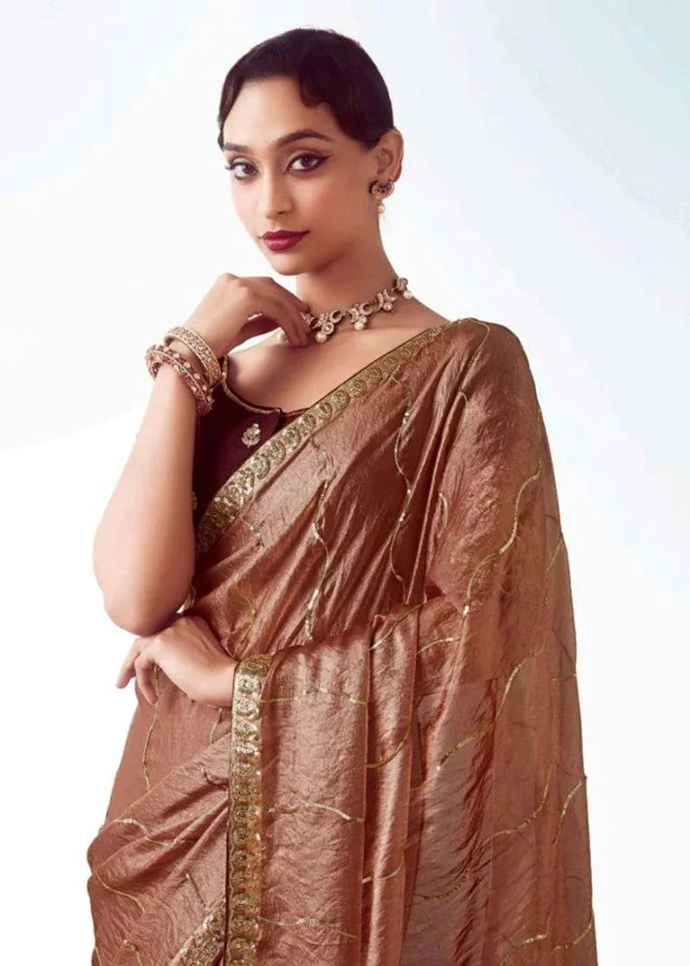 Buy Brown Fancy Fabric Embroidered Designer Saree Online in USA, UK, Canada, France, Germany, Italy, Denmark, UAE, Singapore, Australia & Worldwide at Empress.