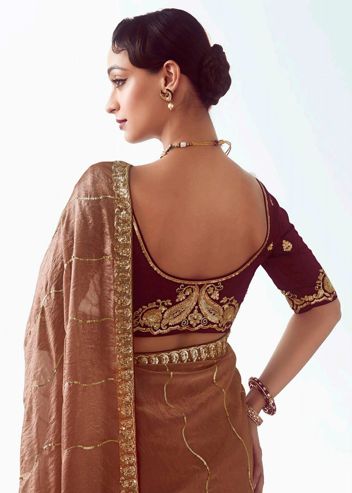 Buy Brown Fancy Fabric Embroidered Designer Saree Online in USA, UK, Canada, France, Germany, Italy, Denmark, UAE, Singapore, Australia & Worldwide at Empress.