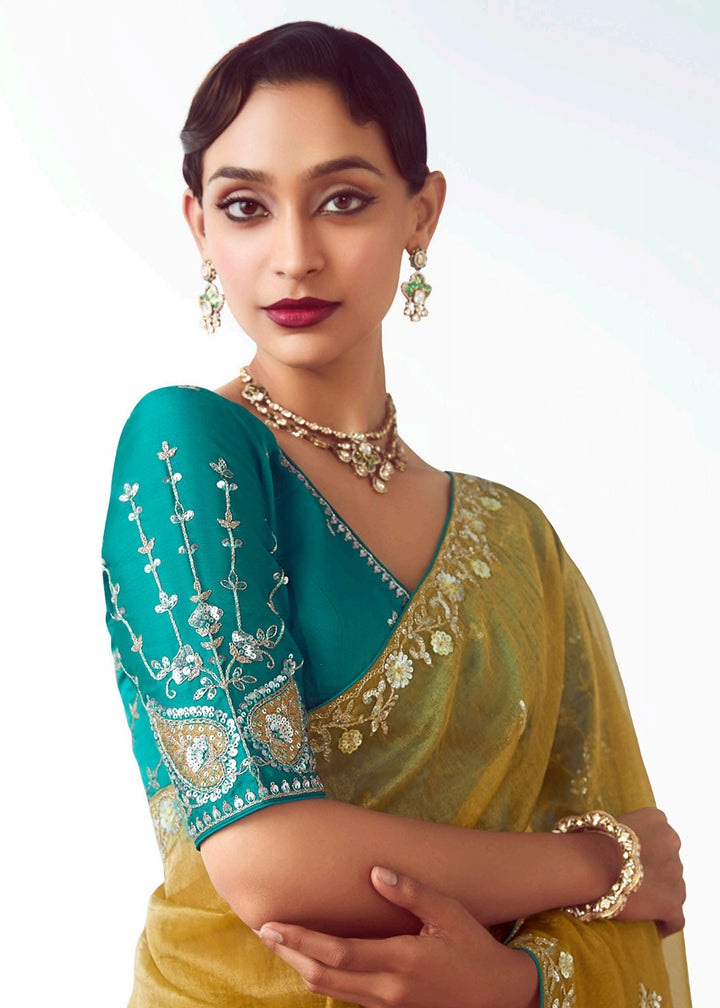 Buy Yellow & Teal Fancy Fabric Embroidered Designer Saree Online in USA, UK, Canada, France, Germany, Italy, Denmark, UAE, Singapore, Australia & Worldwide at Empress.