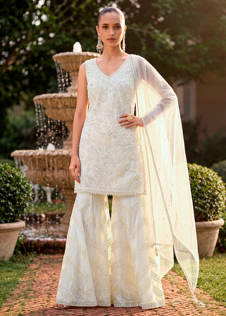 Shop Now Cream Moti &amp; Cutdana with Floral Work Party Sharara Suit Online at Empress in US, UK, Canada, Italy, Germany, France, Greece, Sweden, UAE &amp; Worldwide.