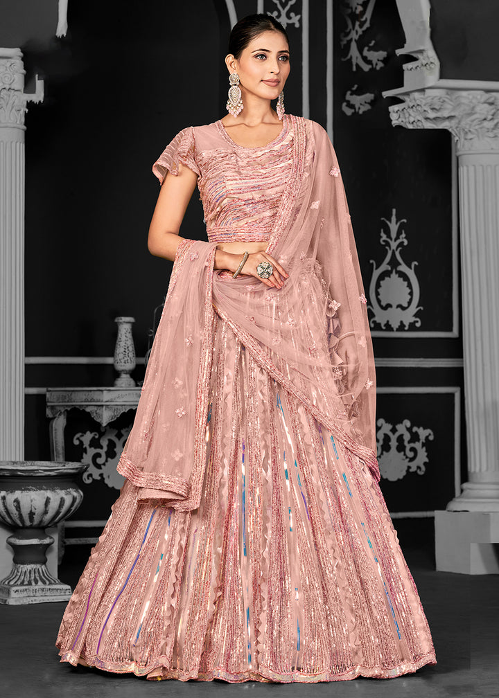Buy Now Appealing Peach Net Embroidered Bridal Party Lehenga Choli Online in USA, UK, Canada, France, Italy, Germany, Australia & Worldwide at Empress Clothing.