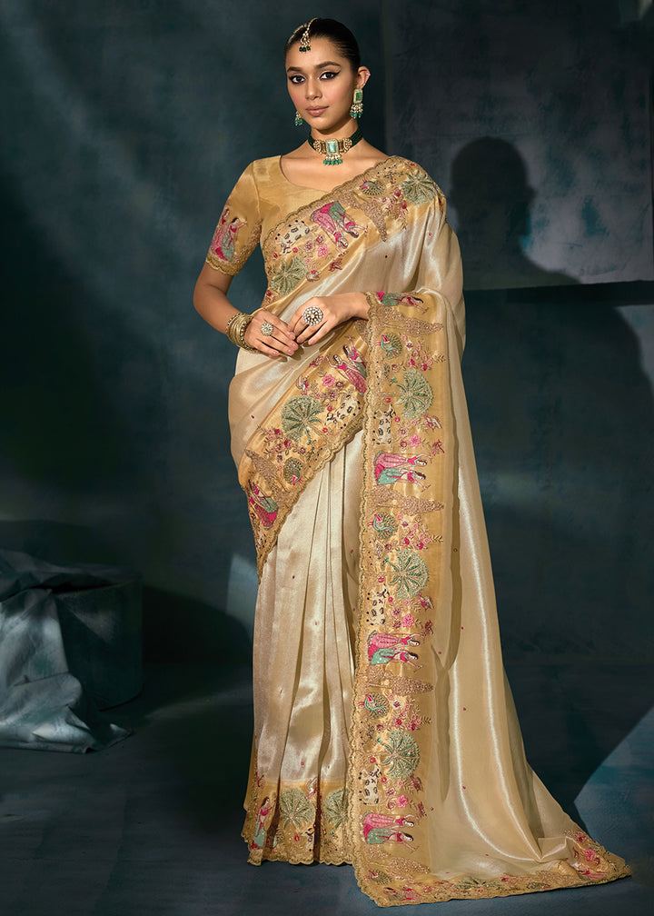 Buy Creamy Cut Dana & Mirror Work Designer Saree Online in US, UK, Canada, France, Germany, Italy, Denmark, Singapore, Belgium, UAE & Worldwide at Empress.
