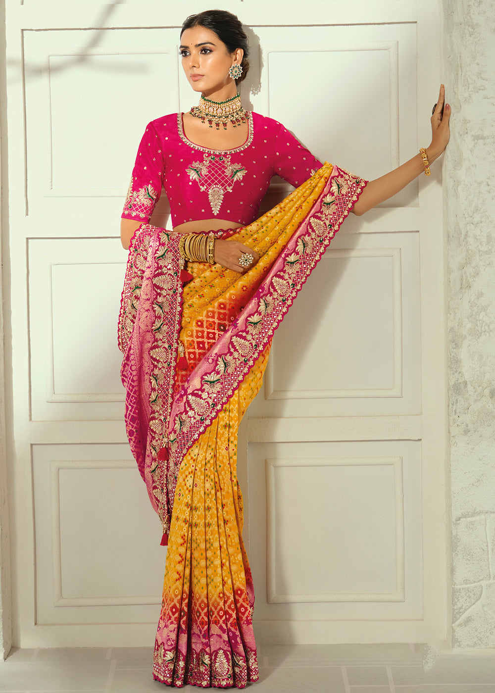 Buy Now Yellow Moti &amp; Cut-Dana Heavy Bandhej Saree Online in US, UK, Canada, France, Germany, Denmark, Sweden, Australia, Austria, UAE &amp; Worldwide at Empress.