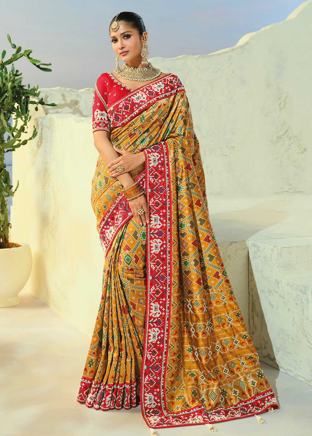 Buy Now Regal Mustard Patan Patola Style Traditional Wear Saree Set Online in US, UK, Canada, France, Germany, Denmark, Sweden, Austria & Worldwide at Empress.