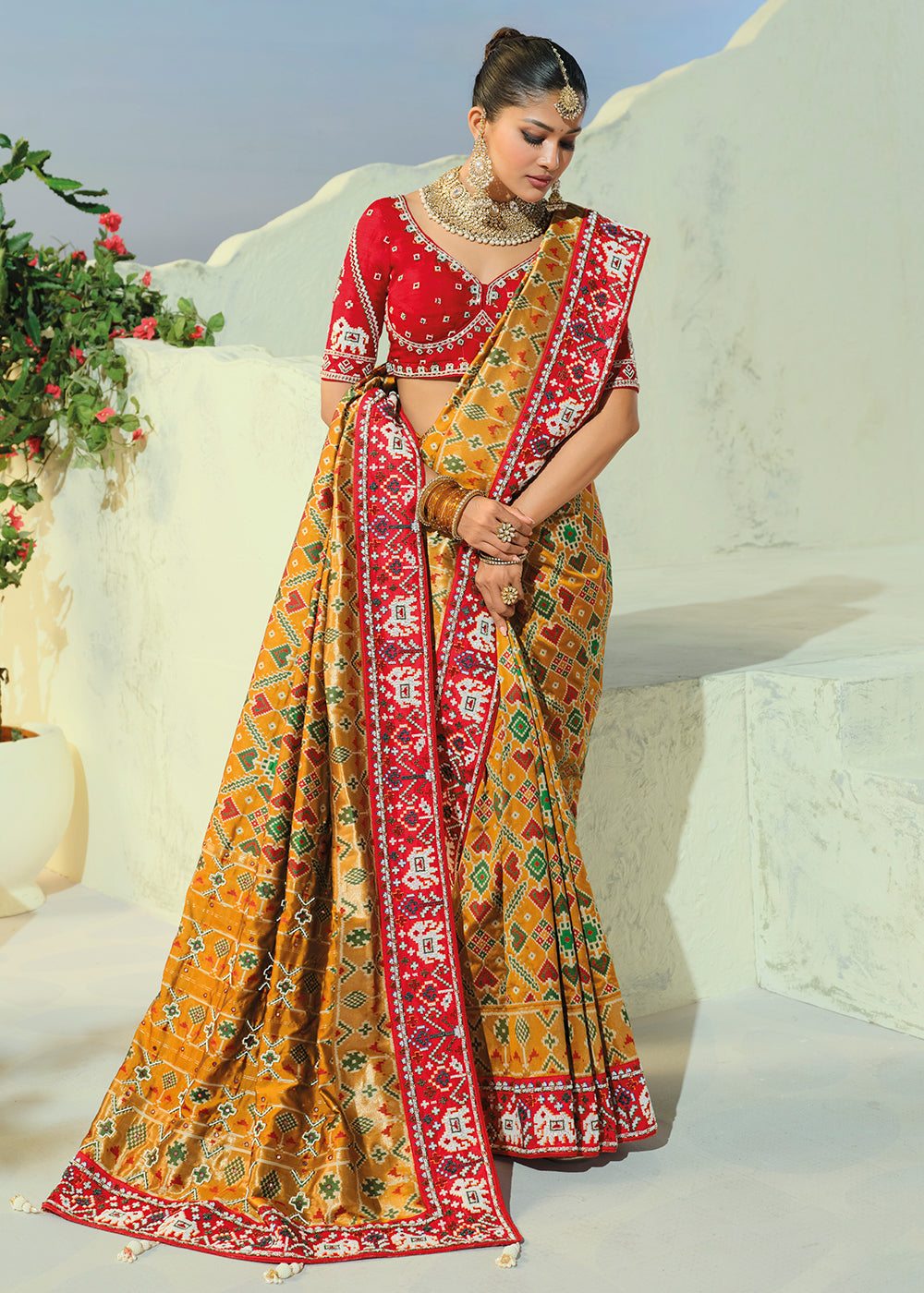 Buy Now Regal Mustard Patan Patola Style Traditional Wear Saree Set Online in US, UK, Canada, France, Germany, Denmark, Sweden, Austria &amp; Worldwide at Empress.