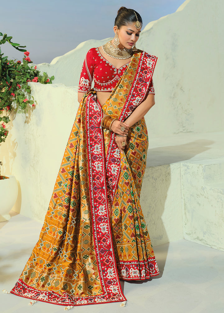 Buy Now Regal Mustard Patan Patola Style Traditional Wear Saree Set Online in US, UK, Canada, France, Germany, Denmark, Sweden, Austria &amp; Worldwide at Empress.