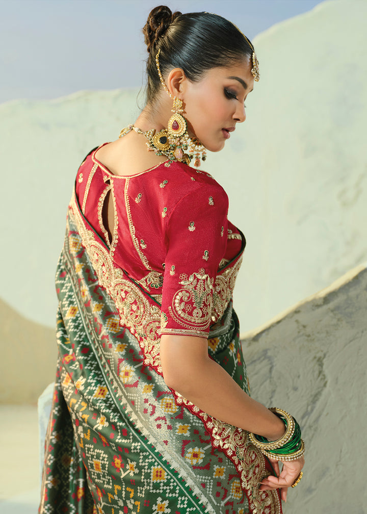 Buy Now Royal Green Patan Patola Style Traditional Wear Saree Set Online in US, UK, Canada, France, Germany, Denmark, Sweden, Austria &amp; Worldwide at Empress.