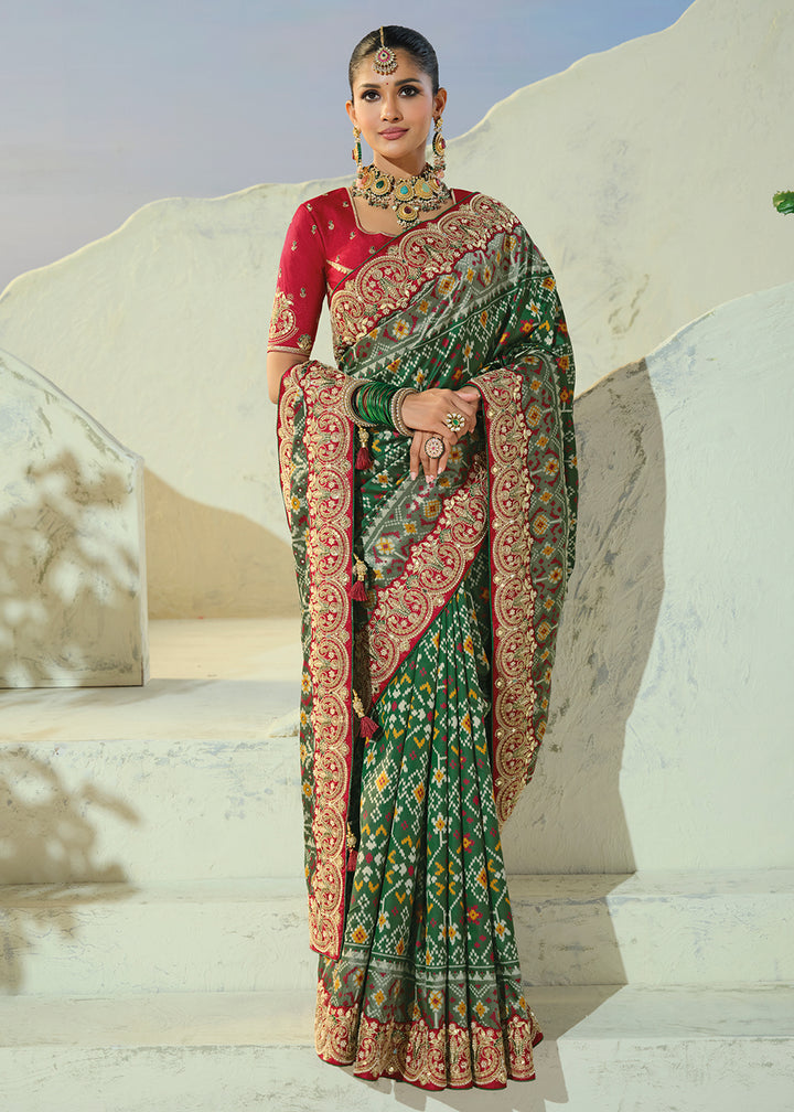 Buy Now Royal Green Patan Patola Style Traditional Wear Saree Set Online in US, UK, Canada, France, Germany, Denmark, Sweden, Austria &amp; Worldwide at Empress.