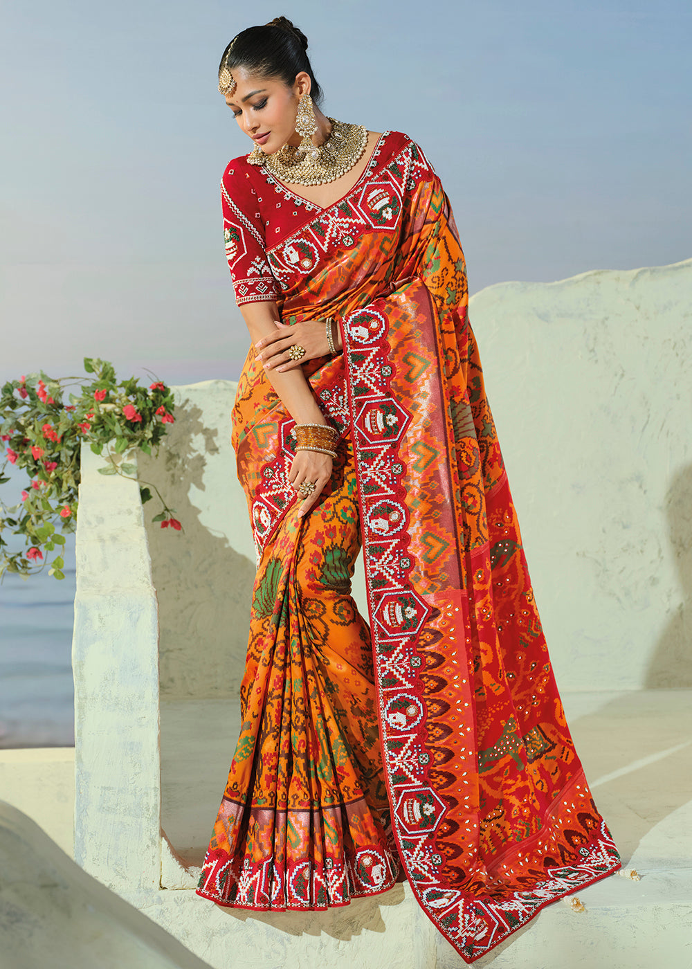 Buy Now Royal Orange Patan Patola Style Traditional Wear Saree Set Online in US, UK, Canada, France, Germany, Denmark, Sweden, Austria & Worldwide at Empress.