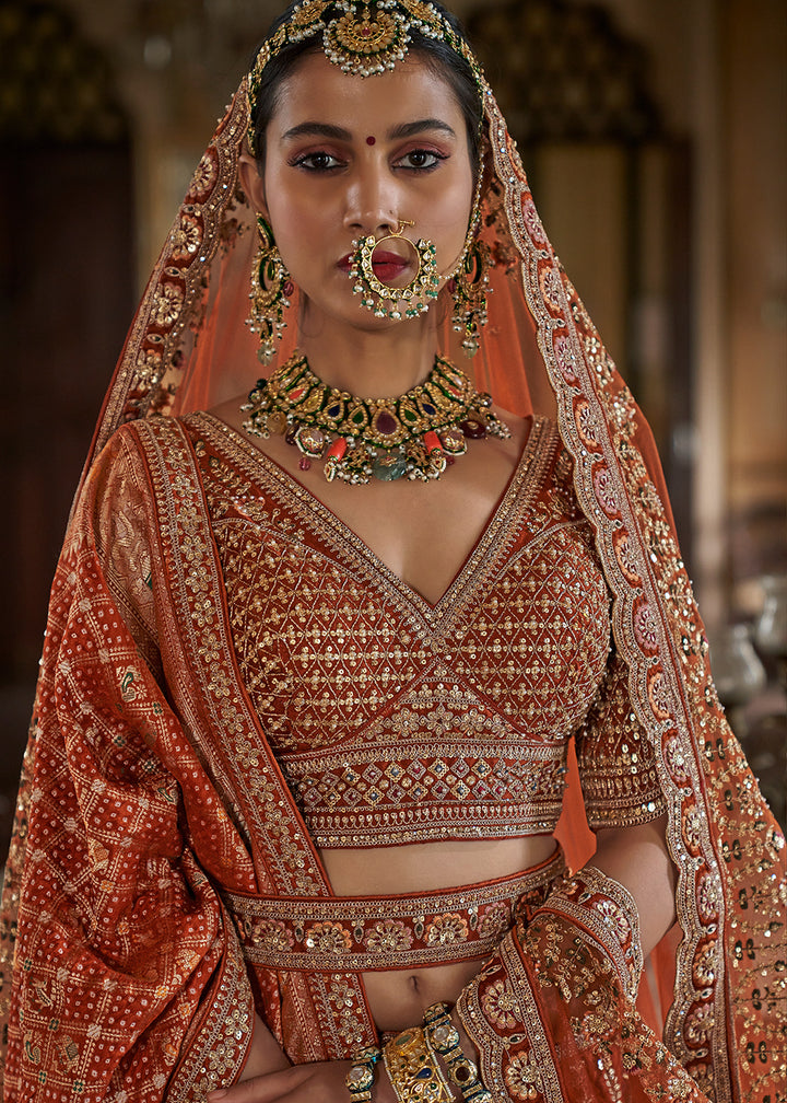 Buy Now Rust Orange Sabyasachi Inspired Bridal Silk Lehenga Choli Online in US, UK, Canada, France, Italy, Germany, Austria, Denmark & Worldwide at Empress.