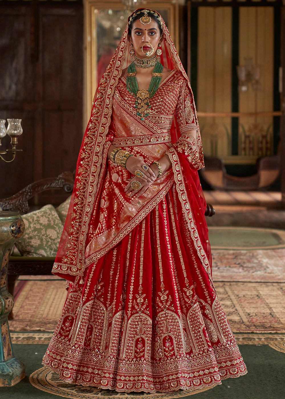 Buy Now Cherry Red Sabyasachi Inspired Bridal Silk Lehenga Choli Online in US, UK, Canada, France, Italy, Germany, Austria, Denmark, UAE & Worldwide at Empress.