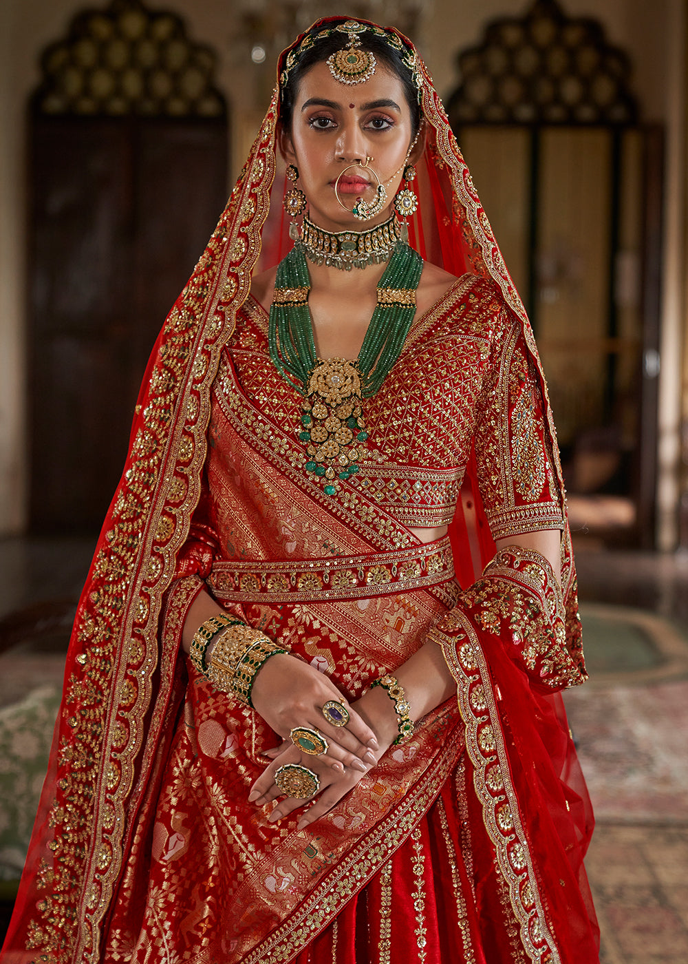 Buy Now Cherry Red Sabyasachi Inspired Bridal Silk Lehenga Choli Online in US, UK, Canada, France, Italy, Germany, Austria, Denmark, UAE & Worldwide at Empress.