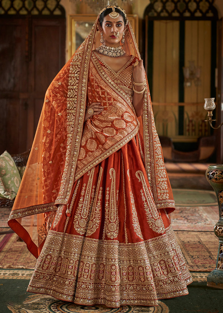 Buy Now Sabyasachi Inspired Rust Orange Bridal Silk Lehenga Choli Online in US, UK, Canada, France, Italy, Germany, Austria, Denmark, UAE & Worldwide at Empress.