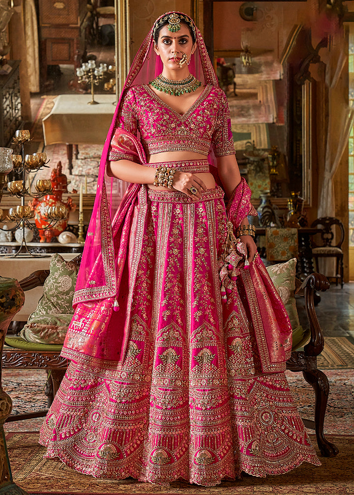 Buy Now Rani Pink Bridal Silk Sabyasachi Inspired Lehenga Choli Online in US, UK, Canada, France, Italy, Germany, Austria, Denmark & Worldwide at Empress.