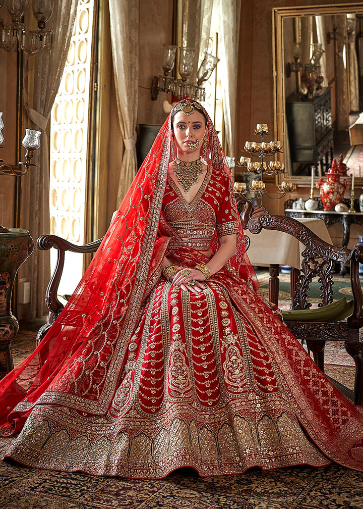 Buy Now Red Bridal Silk Sabyasachi Inspired Lehenga Choli Online in US, UK, Canada, France, Italy, Germany, Austria, Denmark, UAE & Worldwide at Empress.