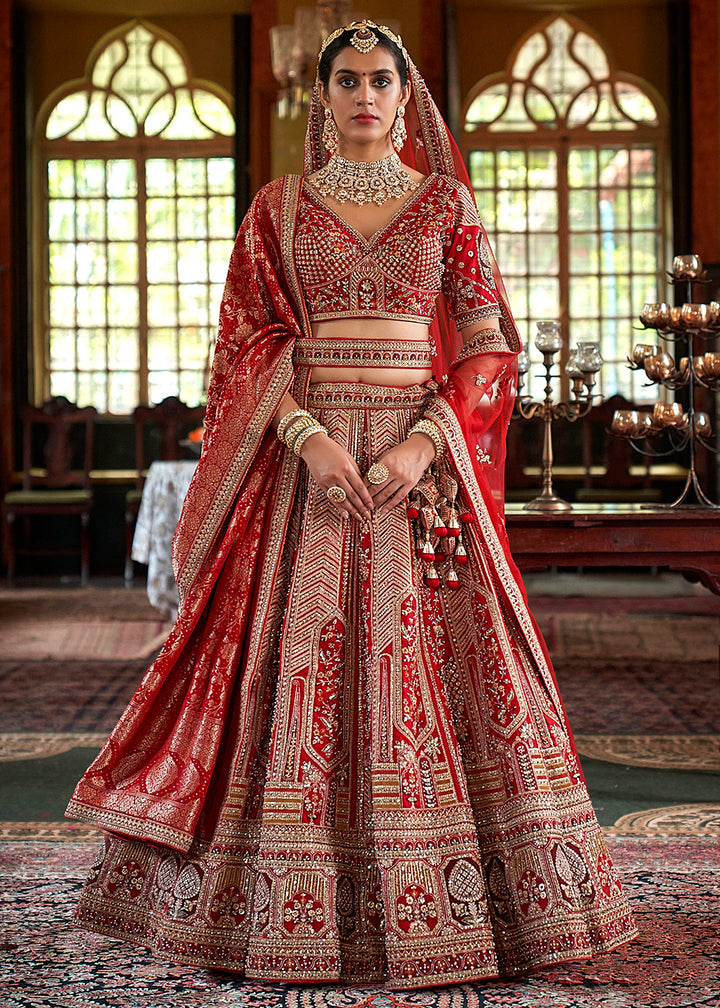 Buy Now Red Silk Heavily Embroidered Bridal Lehenga Choli Online in US, UK, Canada, France, Italy, Germany, Austria, Denmark, UAE & Worldwide at Empress.