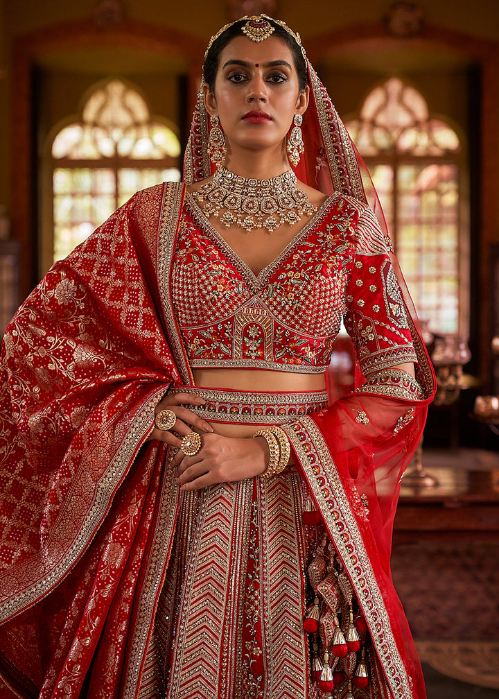 Buy Now Red Silk Heavily Embroidered Bridal Lehenga Choli Online in US, UK, Canada, France, Italy, Germany, Austria, Denmark, UAE & Worldwide at Empress.