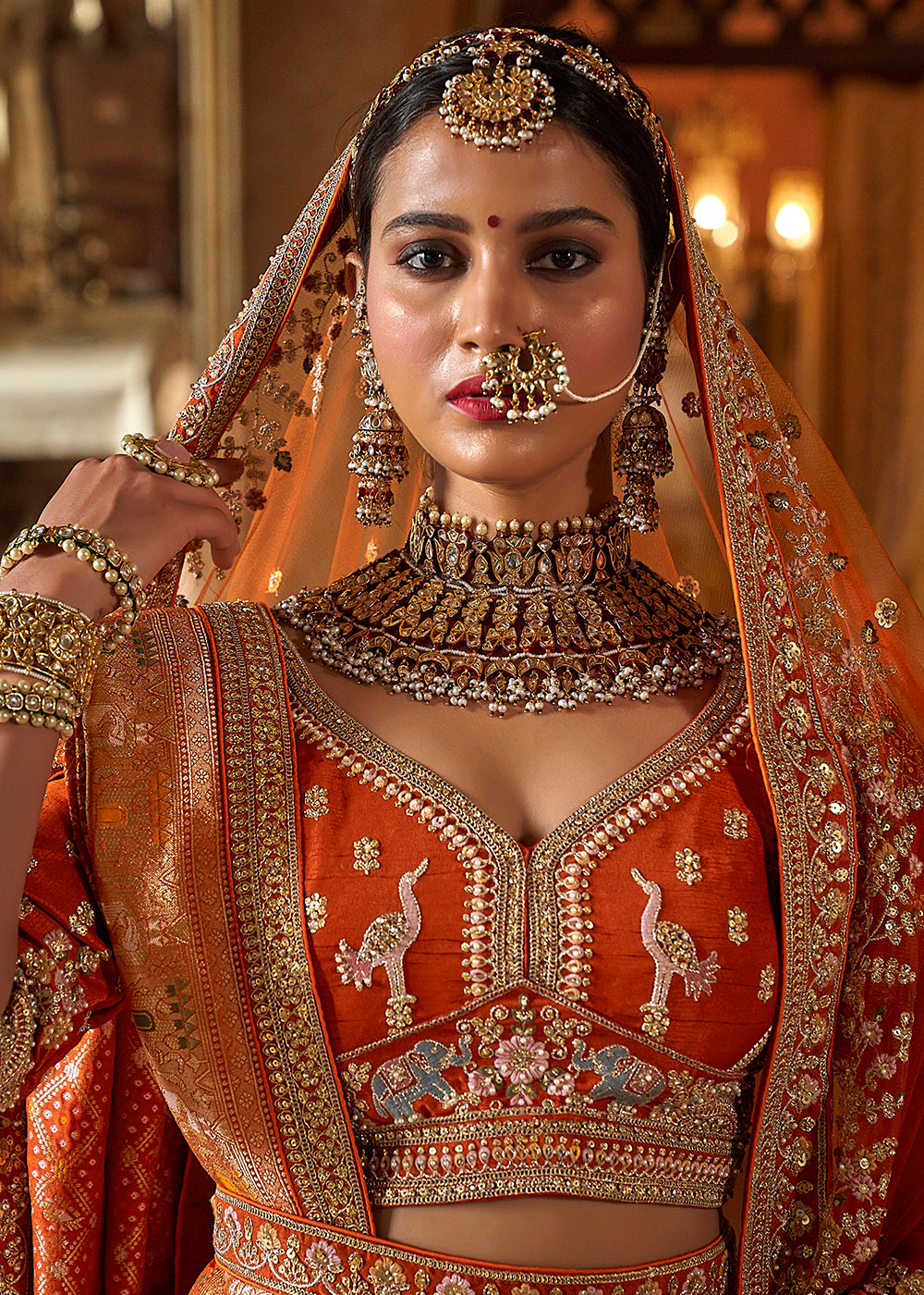 Buy Now Orange Silk Heavily Embroidered Bridal Lehenga Choli Online in US, UK, Canada, France, Italy, Germany, Austria, Denmark, UAE & Worldwide at Empress.