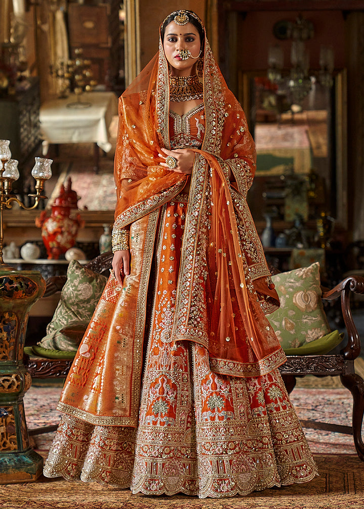 Buy Now Orange Silk Heavily Embroidered Bridal Lehenga Choli Online in US, UK, Canada, France, Italy, Germany, Austria, Denmark, UAE & Worldwide at Empress.
