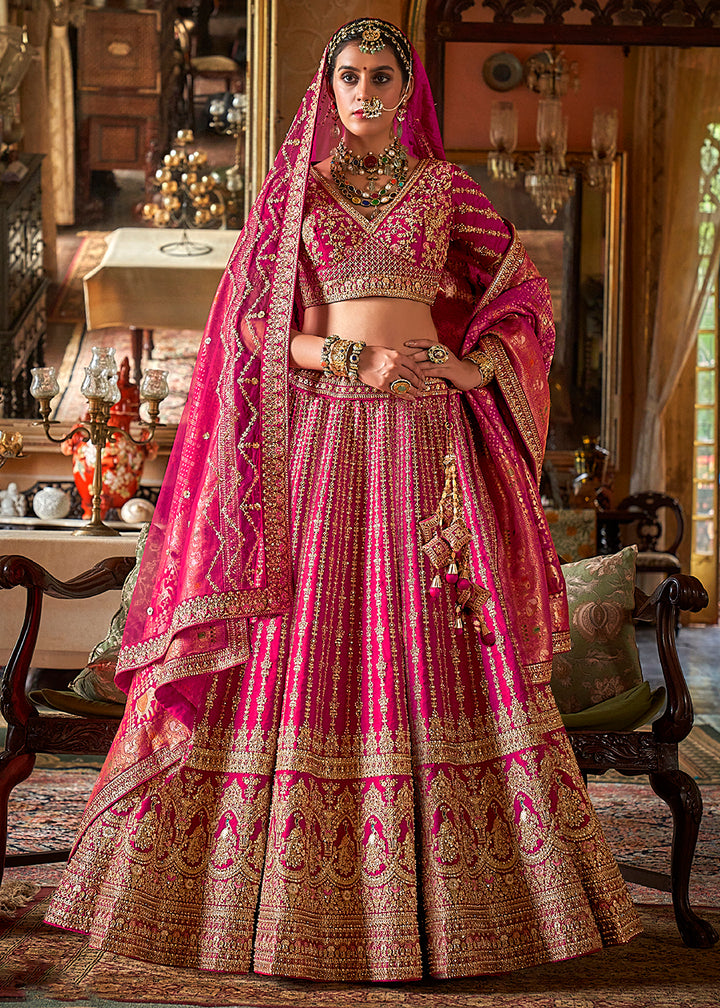 Buy Now Pink Silk Heavily Embroidered Bridal Wear Lehenga Choli Online in US, UK, Canada, France, Italy, Germany, Austria, Denmark, UAE & Worldwide at Empress.