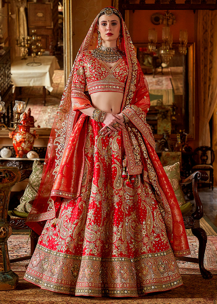 Buy Now Hot Red Silk Heavily Embroidered Bridal Wear Lehenga Choli Online in US, UK, Canada, France, Italy, Germany, Austria, Denmark & Worldwide at Empress.